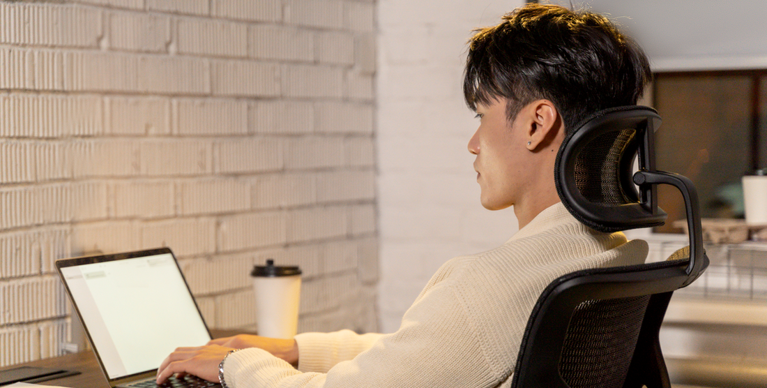 "An ergonomic office setup with an adjustable chair, desk, and properly positioned monitor, keyboard, and mouse, highlighting the importance of good posture and ergonomics in preventing tendinitis."