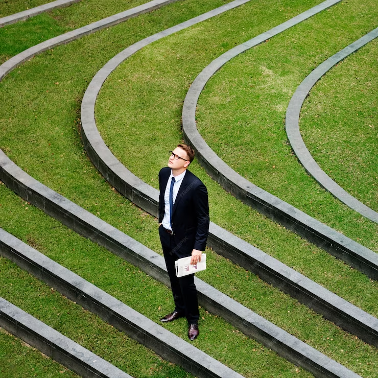 Harmonizing work and life: Person standing at crossroads with paths leading to work and personal life, symbolizing integration and balance.