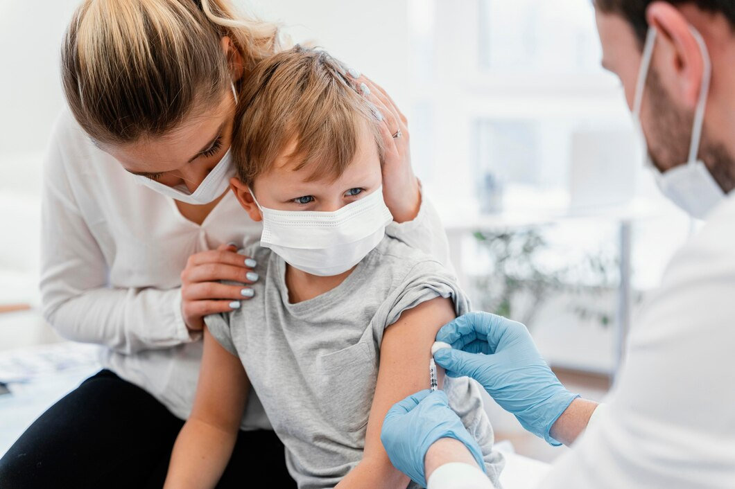 A healthcare professional administering a vaccine to a child in a clinical setting.