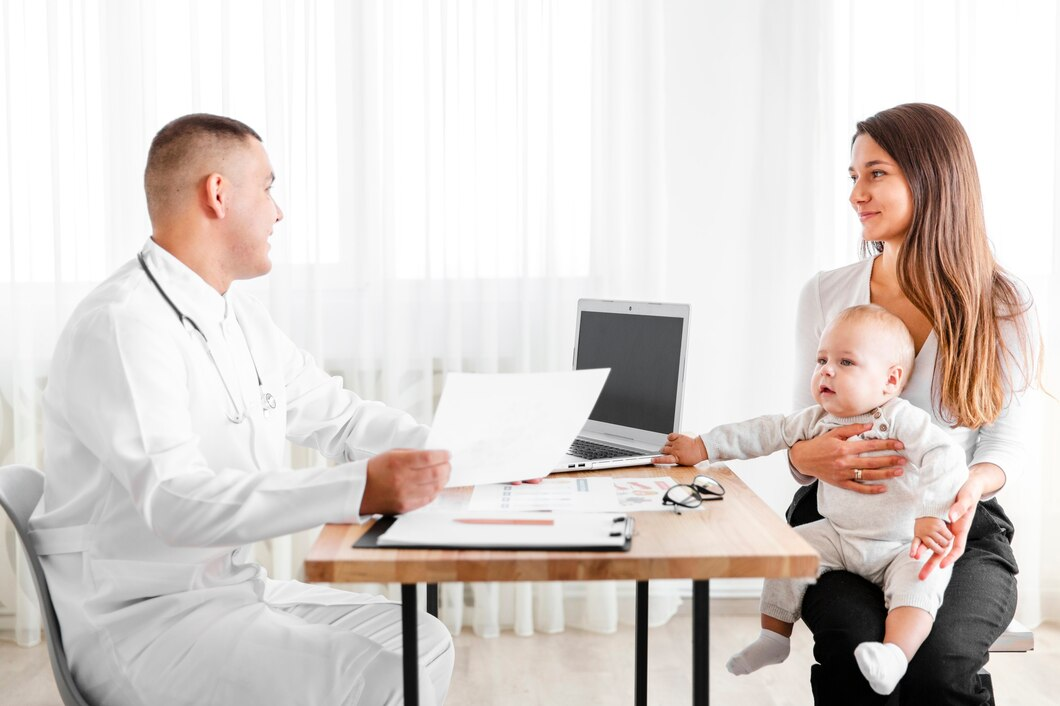 Family doctor discussing health with patient during a check-up.