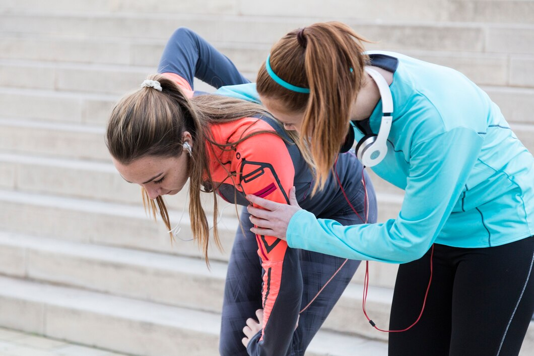  Sports medicine expert guiding athlete in dynamic stretching for injuries prevention