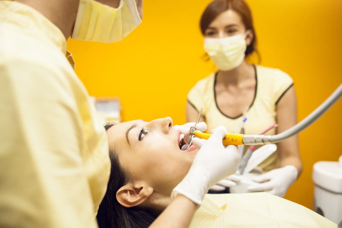 Experience the transformative power of holistic dental care for oral health and overall wellness, with individuals practicing natural dental hygiene techniques amidst the beauty of nature.